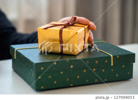 Man is preparing gifts, surprises for holidays, closeup view. 127099053