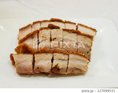 close up of Cantonese Hong Kong style crispy roasted pork belly in three layers cut into pieces close up of Cantonese Hong Kong style crispy roasted pork belly in three layers cut into pieces 127099531