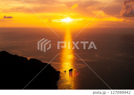 Golden Sunset Beam Reflecting on the Ocean Golden Sunset Beam Reflecting on the Ocean 127099942
