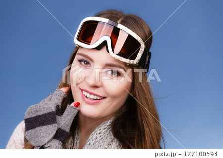 skier girl wearing warm clothes ski googles portrait. skier girl wearing warm clothes ski googles portrait. 127100593