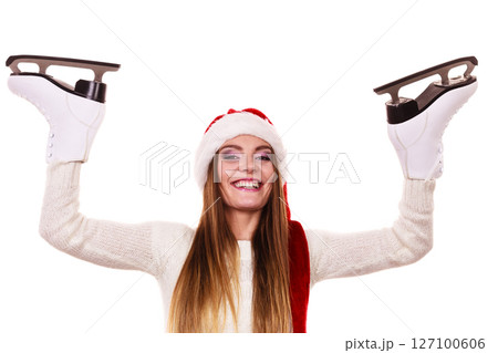 woman santa claus with ice skates woman santa claus with ice skates 127100606
