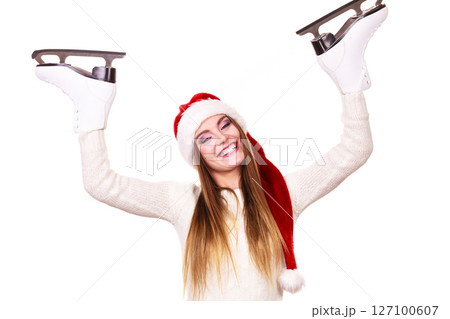 woman santa claus with ice skates woman santa claus with ice skates 127100607