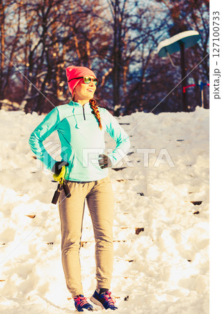 Sporty girl in winter park Sporty girl in winter park 127100733