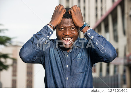 close up of young african man, happy. close up of young african man, happy. 127101462