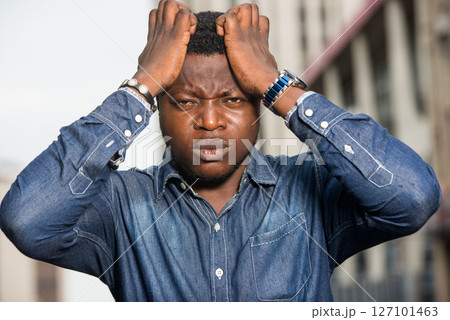 close up of young african man. close up of young african man. 127101463