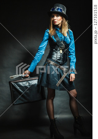 Steampunk girl with retro bag. Steampunk girl with retro bag. 127101518