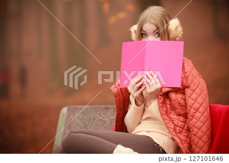 Young lady with literature. 127101646