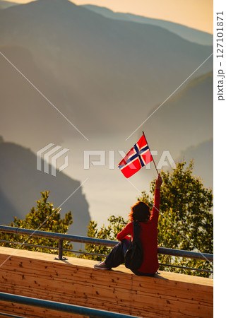 Tourist enjoy fjord view on Stegastein viewpoint Norway 127101871