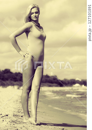 Beautiful woman standing with costume. 127101891