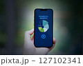 hand holding smartphone chart business app infos 127102341