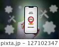 composite image of hand holding smartphone with shopping icon infos 127102347