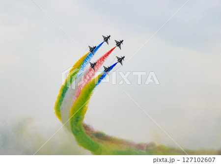 J-10 of China Air Force Aerobatics team on formations with colorful smokes venting from the plane. 127102607