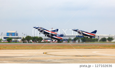 J-10 of China Air Force Aerobatics team on take off formations at airshow in Thailand. 127102636