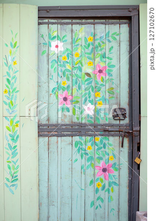 Old Bar Town, Montenegro - February 8, 2025: Handmade picture painted on a glass door on street of Old Bar Town, Montenegro. 127102670