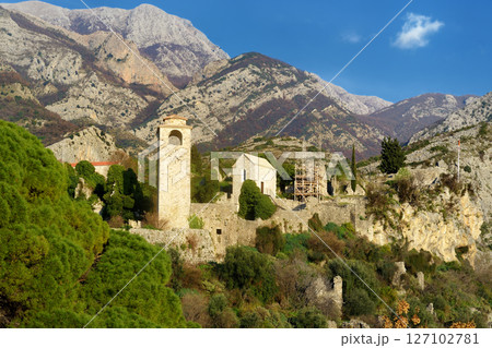 Picturesque view of Clock Tower in Old Town Bar (Stari Grad Bar) on the background of majestic Balkans mountains in Montenegro Picturesque view of Clock Tower in Old Town Bar (Stari Grad Bar) on the background of majestic Balkans mountains in Montenegro 127102781