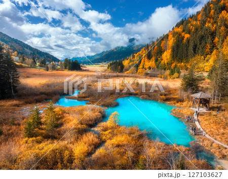 Aerial view of azure lake, mountain, orange forest in autumn Aerial view of azure lake, mountain, orange forest in autumn 127103627