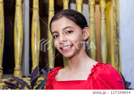 Sweet teenager girl in Cartagena de Indias. Travel concept. Sitting alone. Happy girl. Sweet teenager girl in Cartagena de Indias. Travel concept. Sitting alone. Happy girl. 127104654