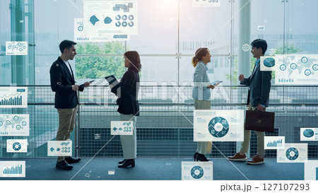 オフィスで会話する多国籍の人々と統計データのコンセプト オフィスで会話する多国籍の人々と統計データのコンセプト 127107293