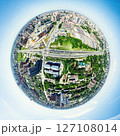Aerial city view with crossroads and roads, houses, buildings, parks and parking lots. Sunny summer panoramic image 127108014