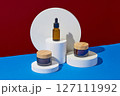 Minimalist creative background for cosmetics or products presentation with space for design label. Three cosmetic mockup bottles decorated with white geometries podiums on color background 127111992