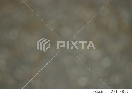 地味で薄汚れた灰色と茶色の混色グラデーション玉ボケテクスチャー 127114097