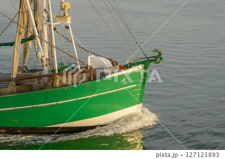 Close-up of the bow of a fishing trawler on the North Sea, Buesum, Schleswig-Holstein, Germany Close-up of the bow of a fishing trawler on the North Sea, Buesum, Schleswig-Holstein, Germany 127121893