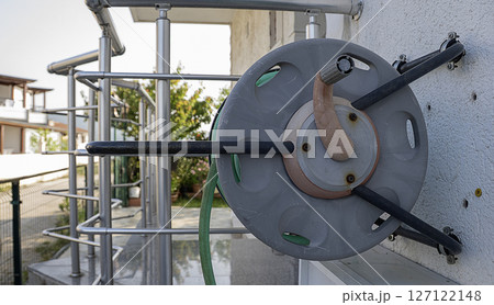 Water hoses on the wall 127122148