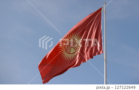 Kyrgyzstan flag is waving in Ala-Too Square 127122649