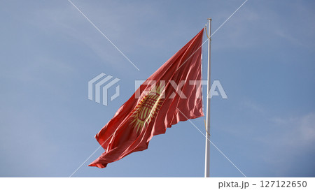Kyrgyzstan flag is waving in Ala-Too Square 127122650
