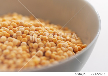 Close up of solid pea groats in round ceramic plate 127122653