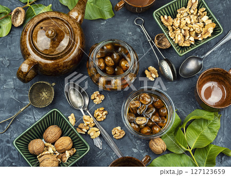 Delicious walnut jam and peeled walnut. Delicious walnut jam and peeled walnut. 127123659