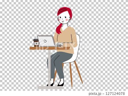 一位女士在咖啡桌旁使用筆記型電腦工作 127124078