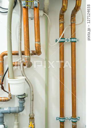 Copper pipes and plumbing system in a modern household Copper pipes and plumbing system in a modern household 127124638