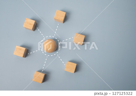 Close-up wooden cubes on light blue background with empty space. Close-up wooden cubes on light blue background with empty space. 127125322