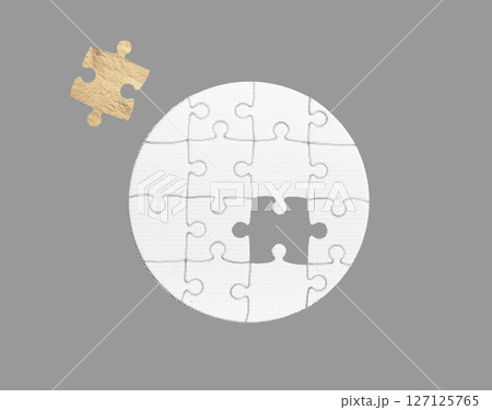 Golden puzzle piece in a round shape, symbolizing the key to solving problems and achieving success. 127125765