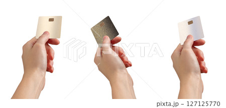 Hand extending a bank card for payment, fingers outstretched, showing credit or debit transaction. 127125770