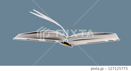 Hand flipping through the pages of an open book in a library, symbolizing knowledge and wisdom. A 127125773