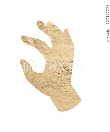 Hand gripping a piece of gold foil with two fingers, showcasing a golden metallic texture. Grasping 127125778