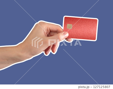 Hand holding a red bank card with chip, symbolizing secure financial transactions and luxury Hand holding a red bank card with chip, symbolizing secure financial transactions and luxury 127125807