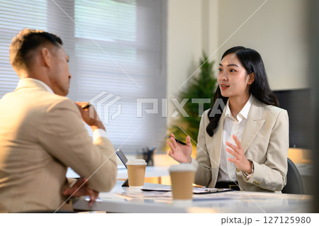 Two colleague discussion on office workplace Two colleague discussion on office workplace 127125980