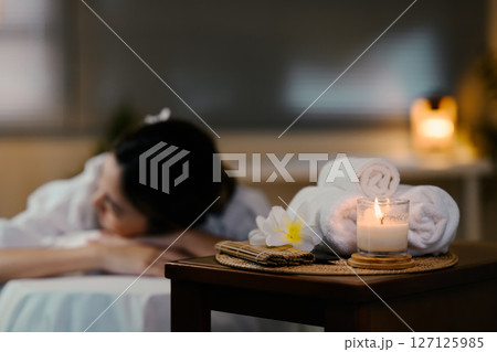 Relaxed lady at spa with focus on spa equipment. Wellness concept Relaxed lady at spa with focus on spa equipment. Wellness concept 127125985