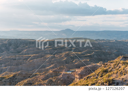 Desert landscape showing erosion in gorafe, spain, at sunset Desert landscape showing erosion in gorafe, spain, at sunset 127126207