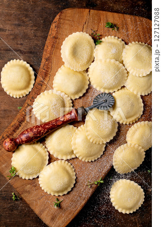 Fresh Homemade Ravioli on Wooden Board 127127088