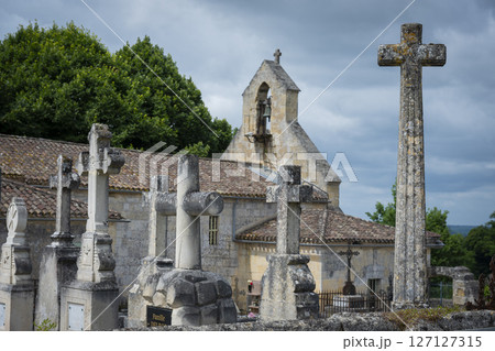 Stone cross cemetery near the church in Saint-Laurent-des-Combes highlighting religious heritage and 127127315