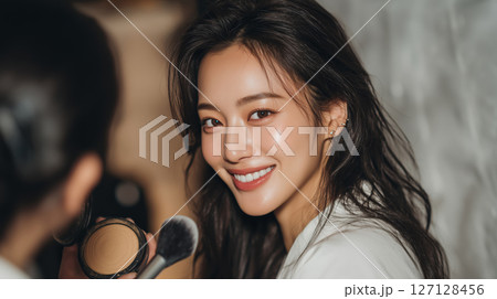 Smiling woman enjoying a beauty session in a warm and inviting setting Smiling woman enjoying a beauty session in a warm and inviting setting 127128456