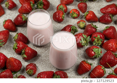 Strawberry Yogurt Served in Glasses Surrounded by Fresh Ripe Strawberries. 127129523