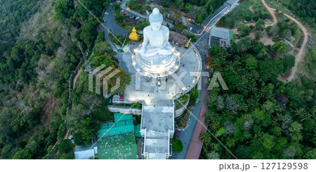 Aerial View drone shot of Big Buddha Statue on the high mountain at Phuket thailand in evening time. 127129598