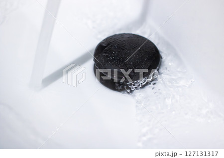 Envision a black hole situated inside a sink where water is rushing out Envision a black hole situated inside a sink where water is rushing out 127131317