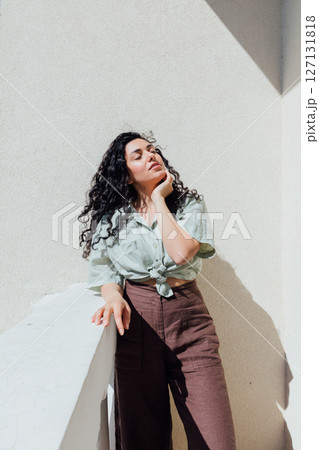 Portrait of a beautiful brunette woman in summer clothes Portrait of a beautiful brunette woman in summer clothes 127131818