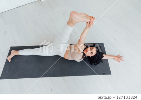 Fitness Woman Brunette Doing Gymnastics Yoga 127131824
